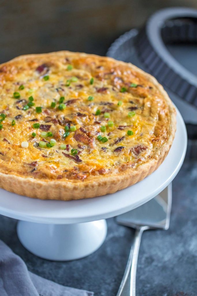What is in Quiche Lorraine? A basic quiche filling with flavorful add-ins: bacon, onions, Swiss cheese and cheddar cheese.
