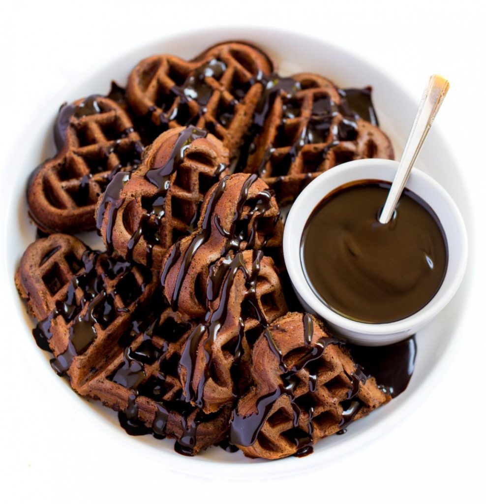 Chocolate Waffles drizzled with chocolate syrup.