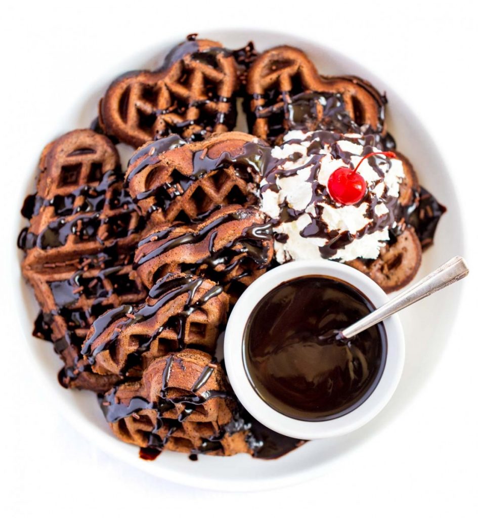 Triple Chocolate Belgian Waffles topped with chocolate fudge, whipped cream and a cherry.