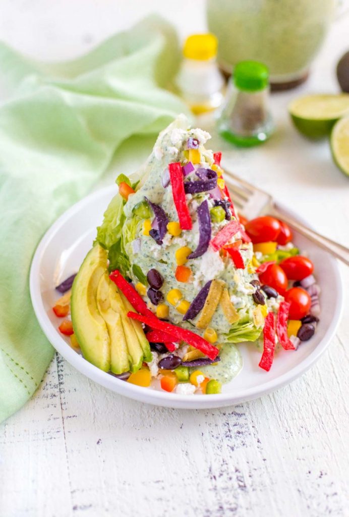 Colorful Mexican Wedge Salad with flavorful garnishes.
