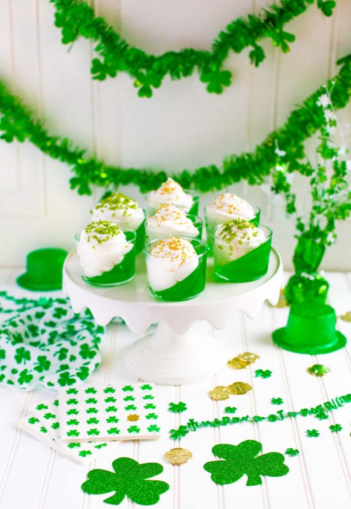 St. Patrick's Day Jello Cups on a festive St. Patrick's Day dessert table.