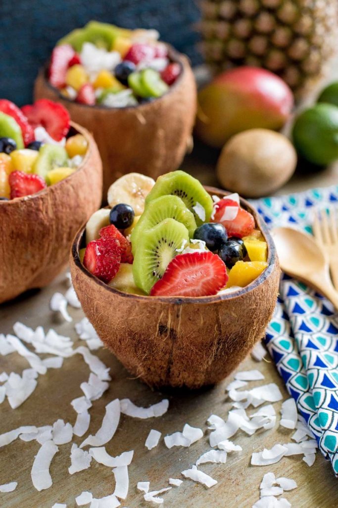 Tropical fruit salad served in coconut bowls.