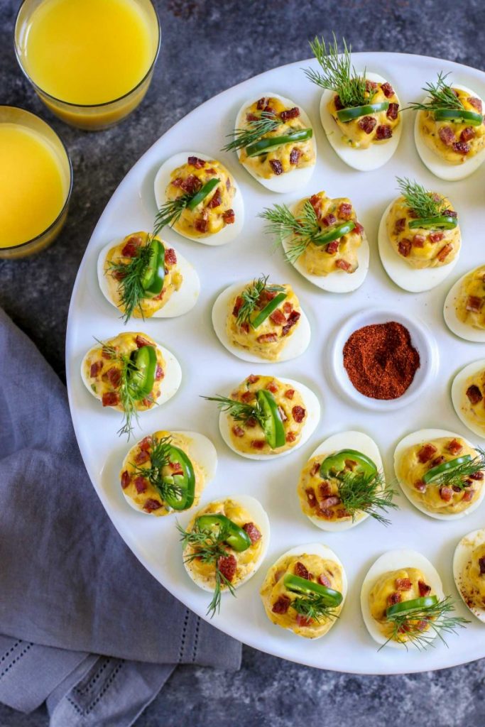 Perfect Deviled Eggs served with glasses of juice