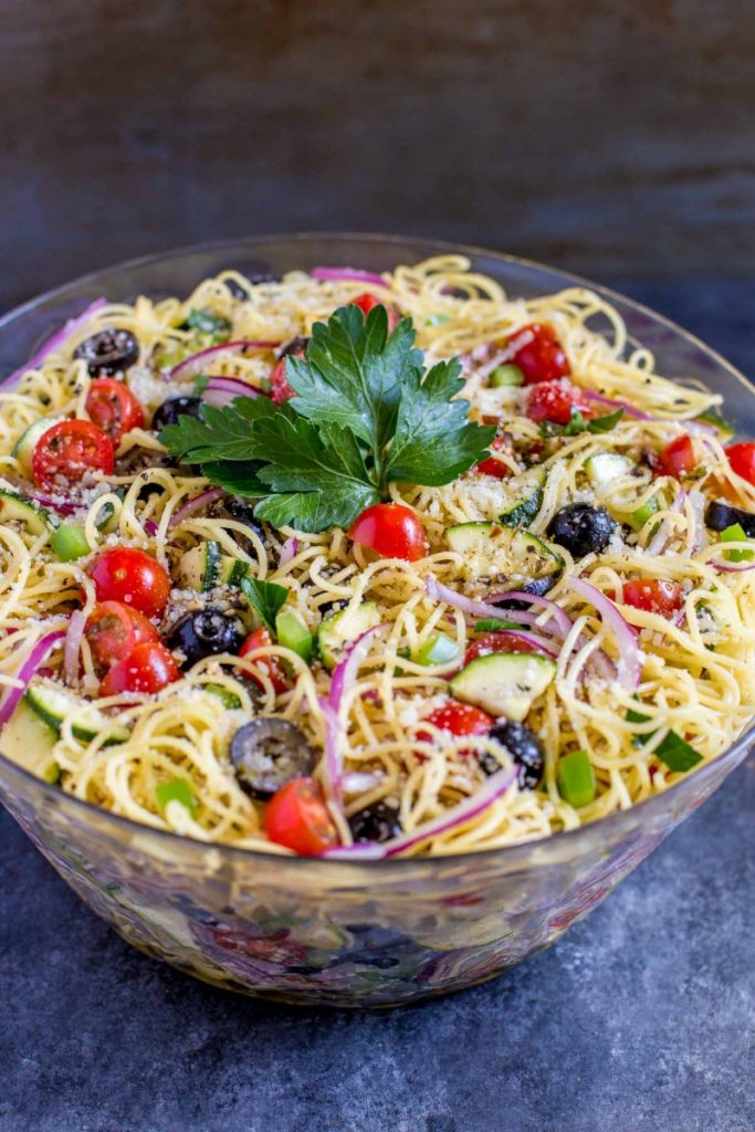 Cold spaghetti salad in a serving bowl.