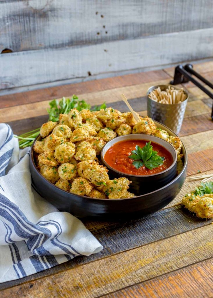 Easy appetizers made with baked tortellini coated in batter.