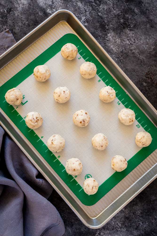 Snowball cookies on a cookie sheet