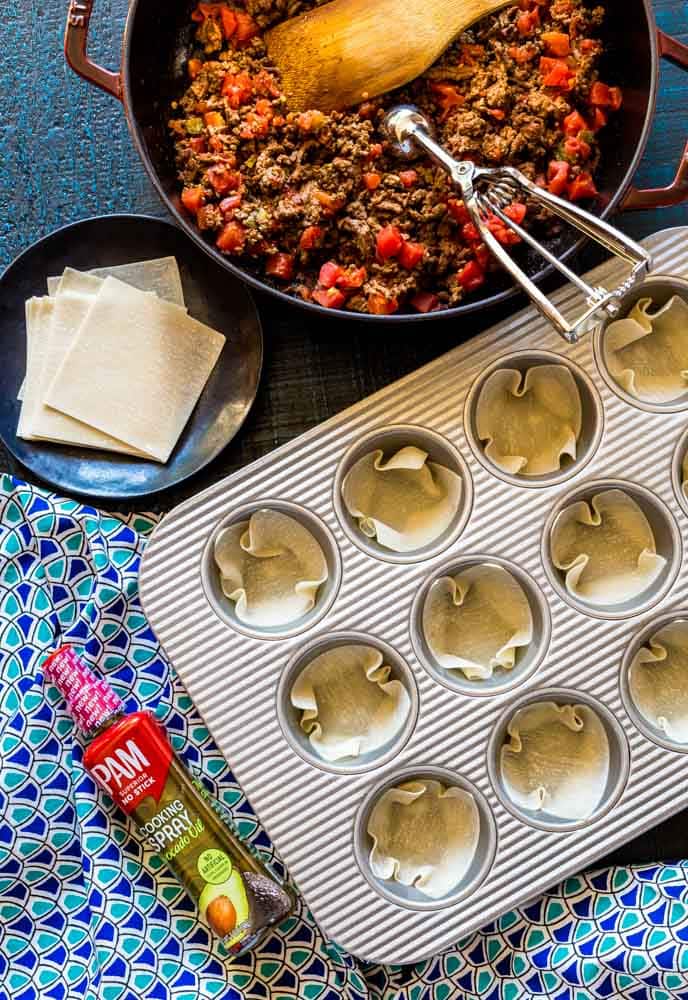 Wonton wrappers in cupcake pan to make taco cups.