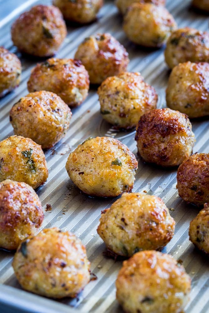 Baked meatballs on a baking tray.