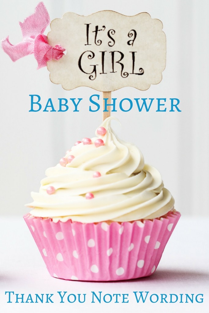 Baby shower cupcake with "it's a girl" sign