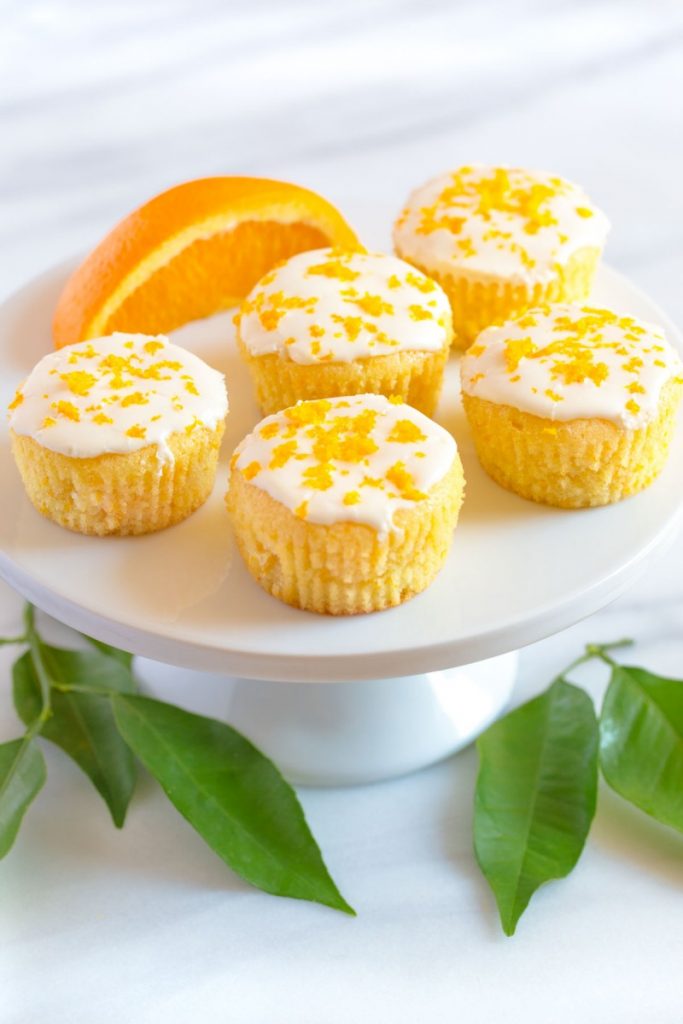 Fresh Orange Muffins on a cake stand