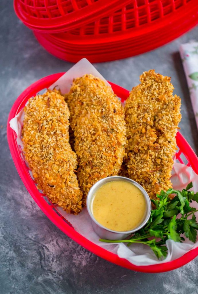 Baked Chicken Tenders breaded with Panko bread crumbs and sweetened shredded coconut.