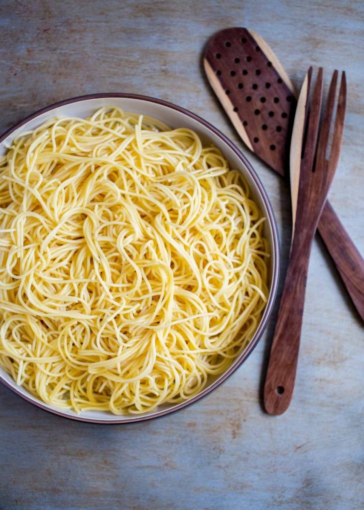 Plain noodles shown without spaghetti sauce in a bowl