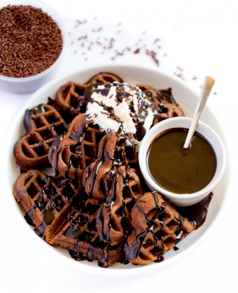 Yummy Chocolate Belgian Waffles with whipped cream and chocolate jimmies.