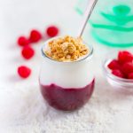 Yogurt parfait layered with fruit compote and sprinkled with granola.
