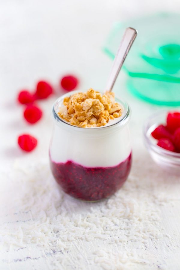 Yogurt parfait layered with fruit compote and sprinkled with granola.