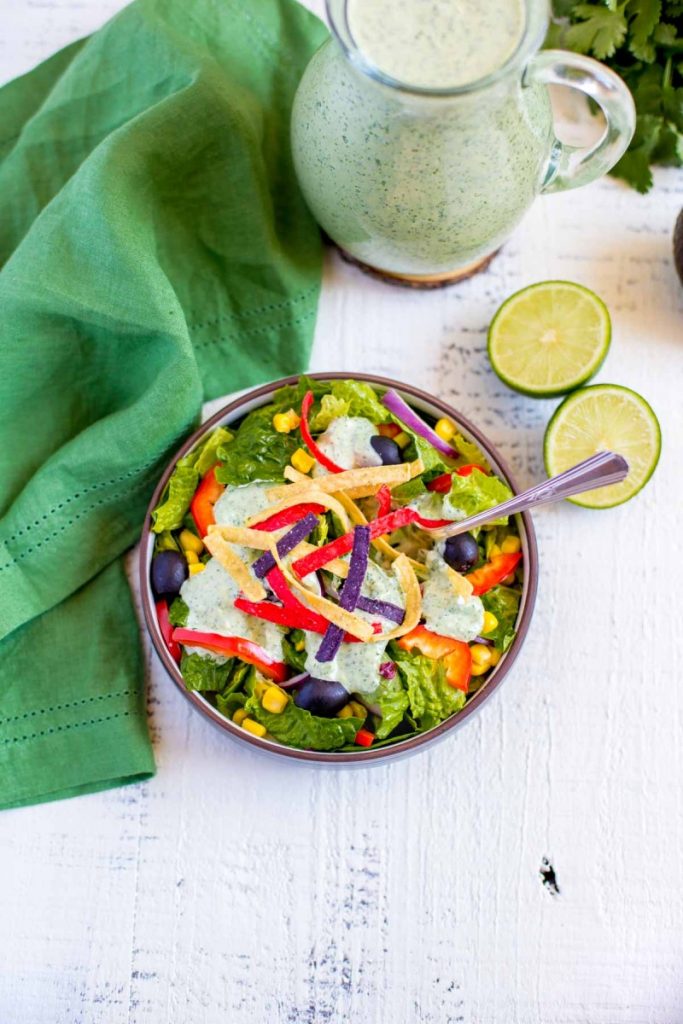 Creamy Cilantro Lime Dressing sprinkled with colorful tortilla strips.