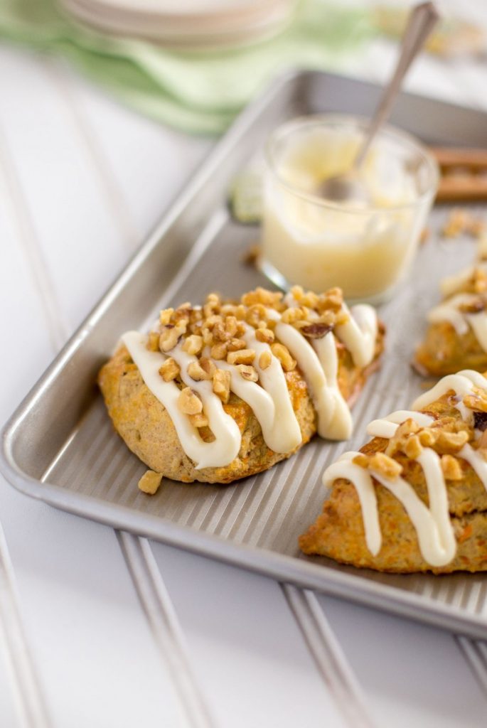 Carrot Cake Scones with cream cheese icing and chopped walnuts.