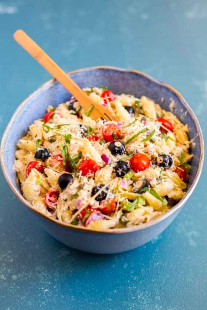 Tuna pasta salad in a serving bowl with spoon.