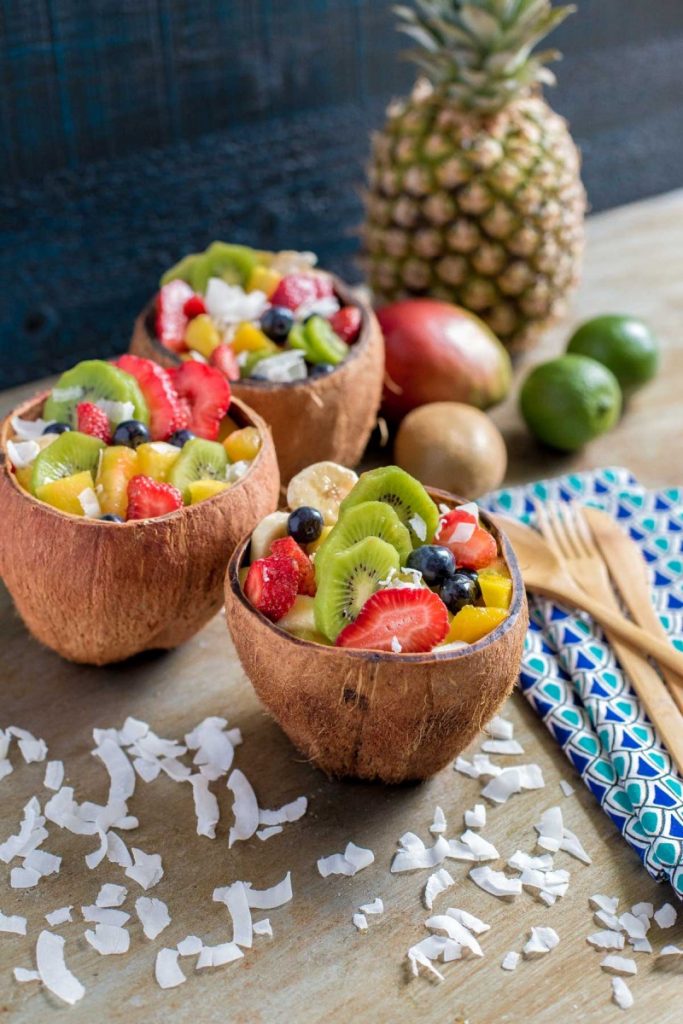 Tropical fruit salad served in coconut bowls.