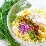 Egg Salad in a clear glass bowl.