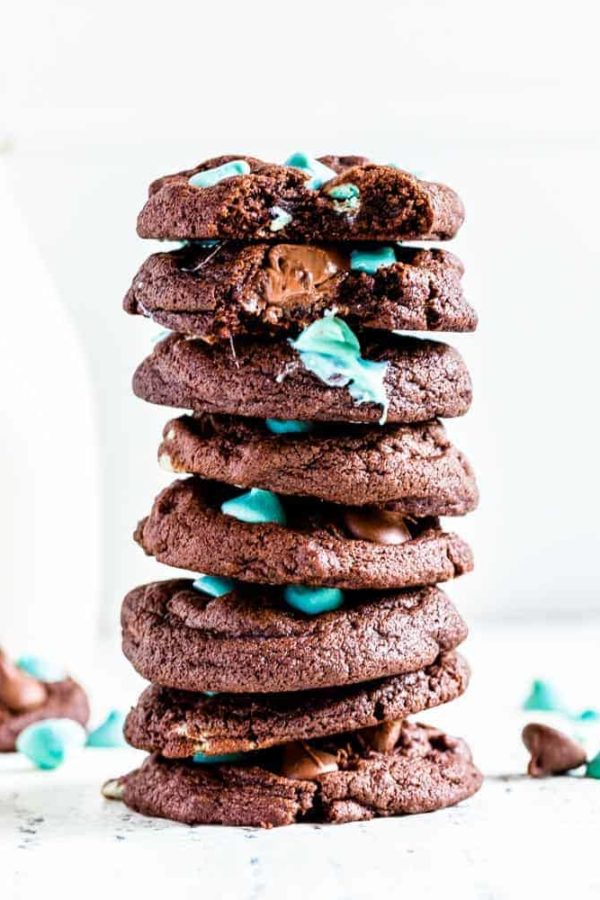 Mint chocolate chip cookies with a glass of milk.