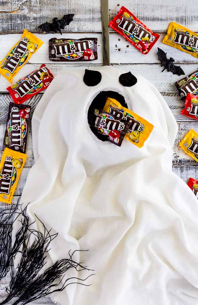 Trick-or-Treat candy dispensed by a Halloween Door Hanger