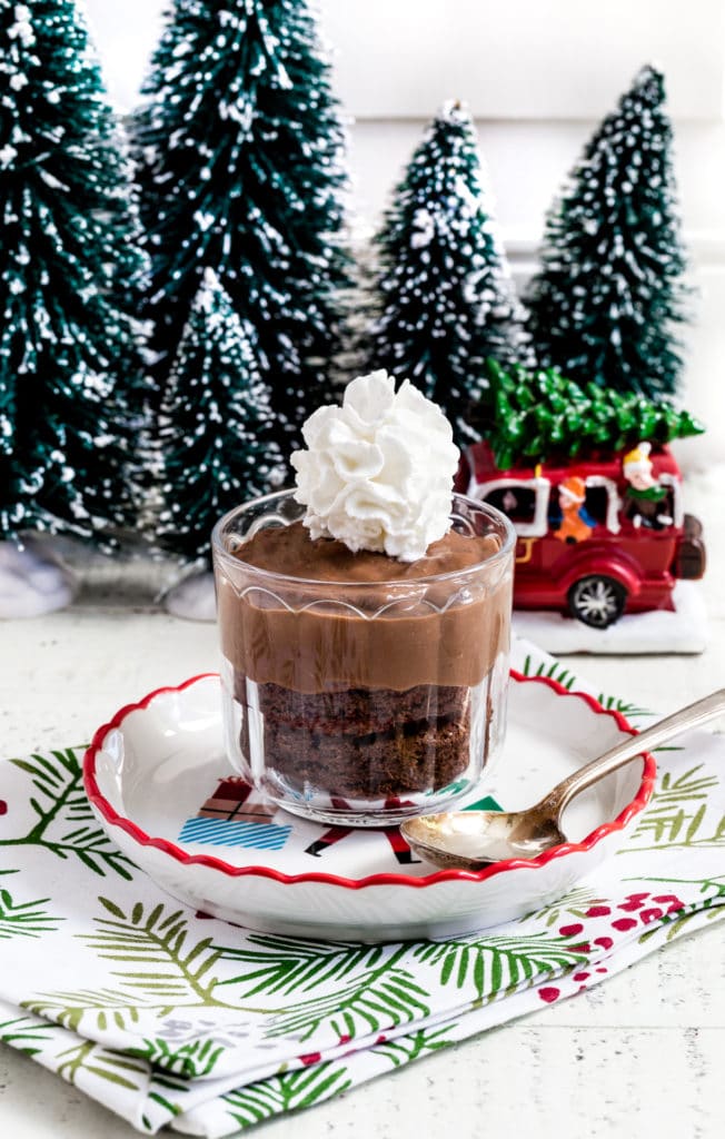 One serving of chocolate pudding dessert topped with whipped cream.