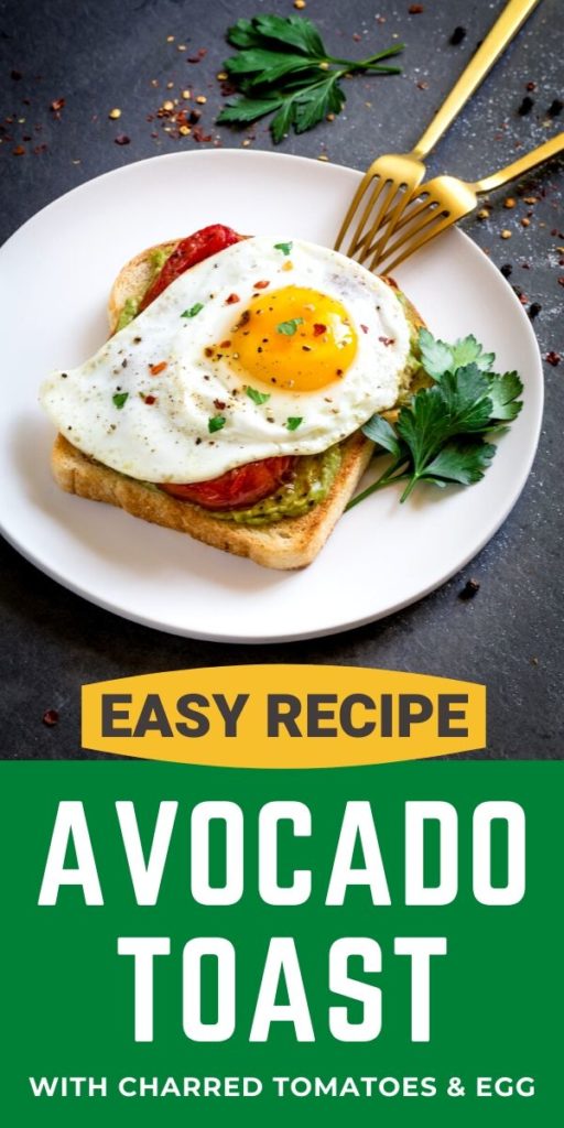 Avocado toast with charred tomatoes and egg on a white plate.