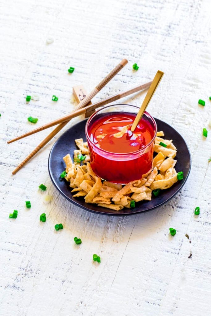 Chinese Sweet and Sour Sauce served with wonton strips.