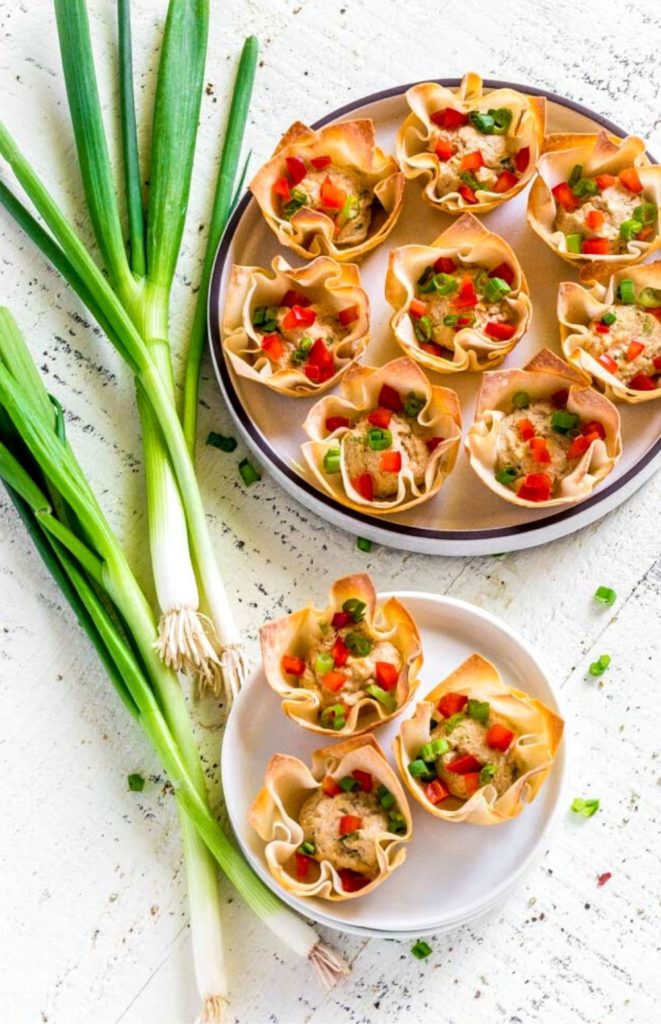 Best crab rangoon recipe served on white platter and an appetizer plate.