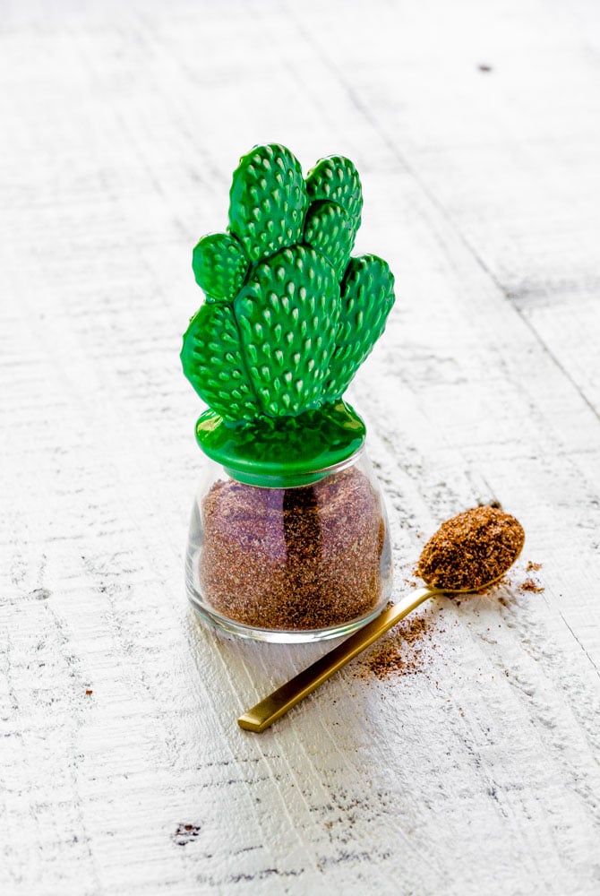 Taco Seasoning stored in a small glass spice jar with cactus lid.