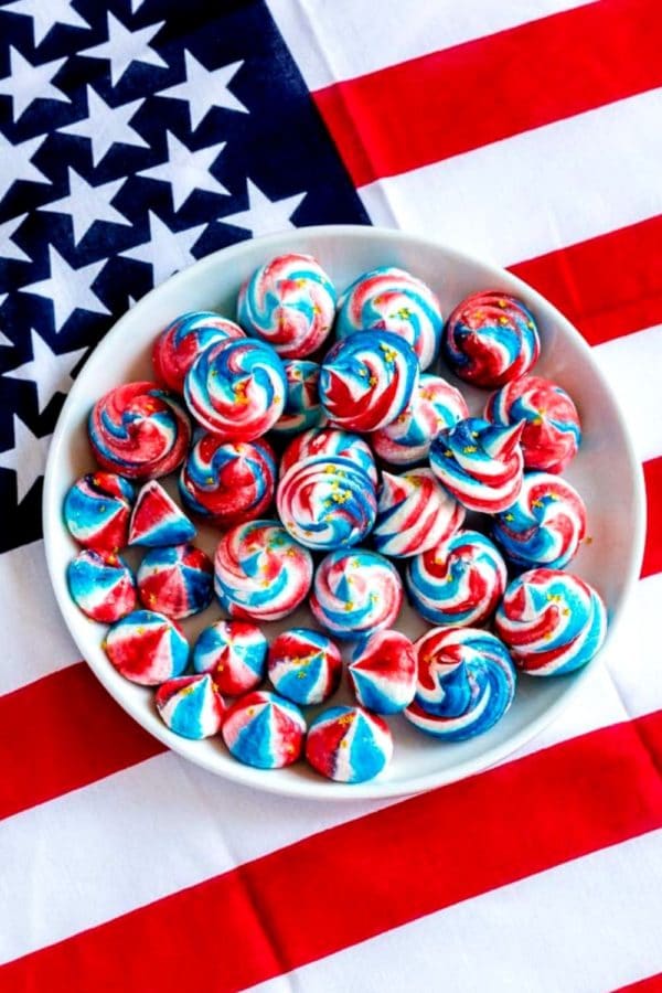 A plate of red, white and blue Meringue Cookies for the 4th of July.