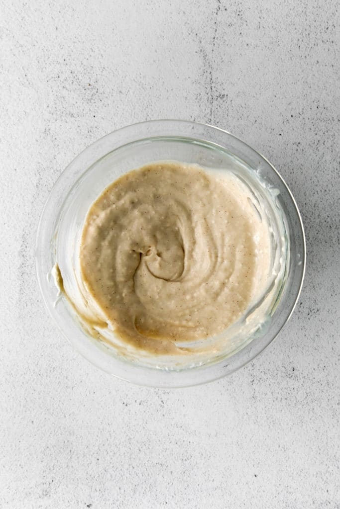 Maple-flavored cream cheese spread assembled in a medium glass mixing bowl.