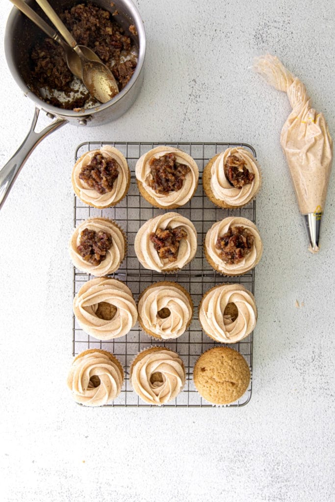 How to frost and garnish butter pecan cupcakes for Thanksgiving.