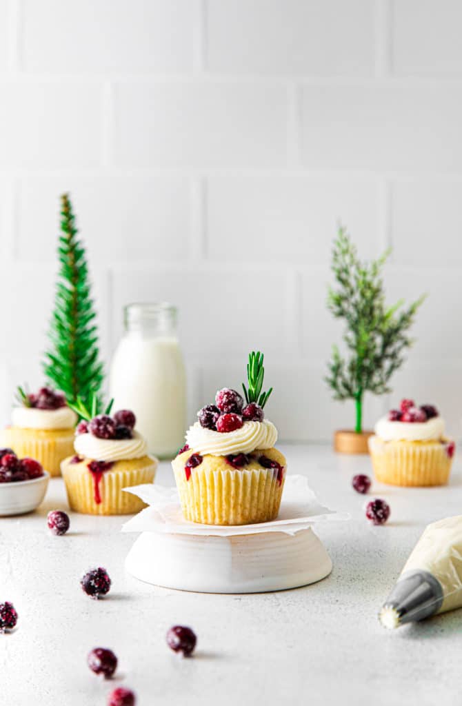 Sugared cranberry cupcakes on a holiday serving table ready to enjoy.
