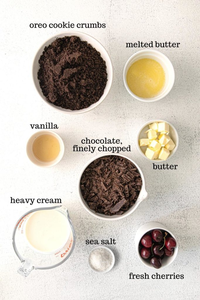 Ingredients for chocolate ganache tarts with Oreo cookie.