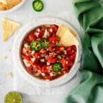 Authentic pico de gallo served in a bowl with restaurant-style tortilla chips.
