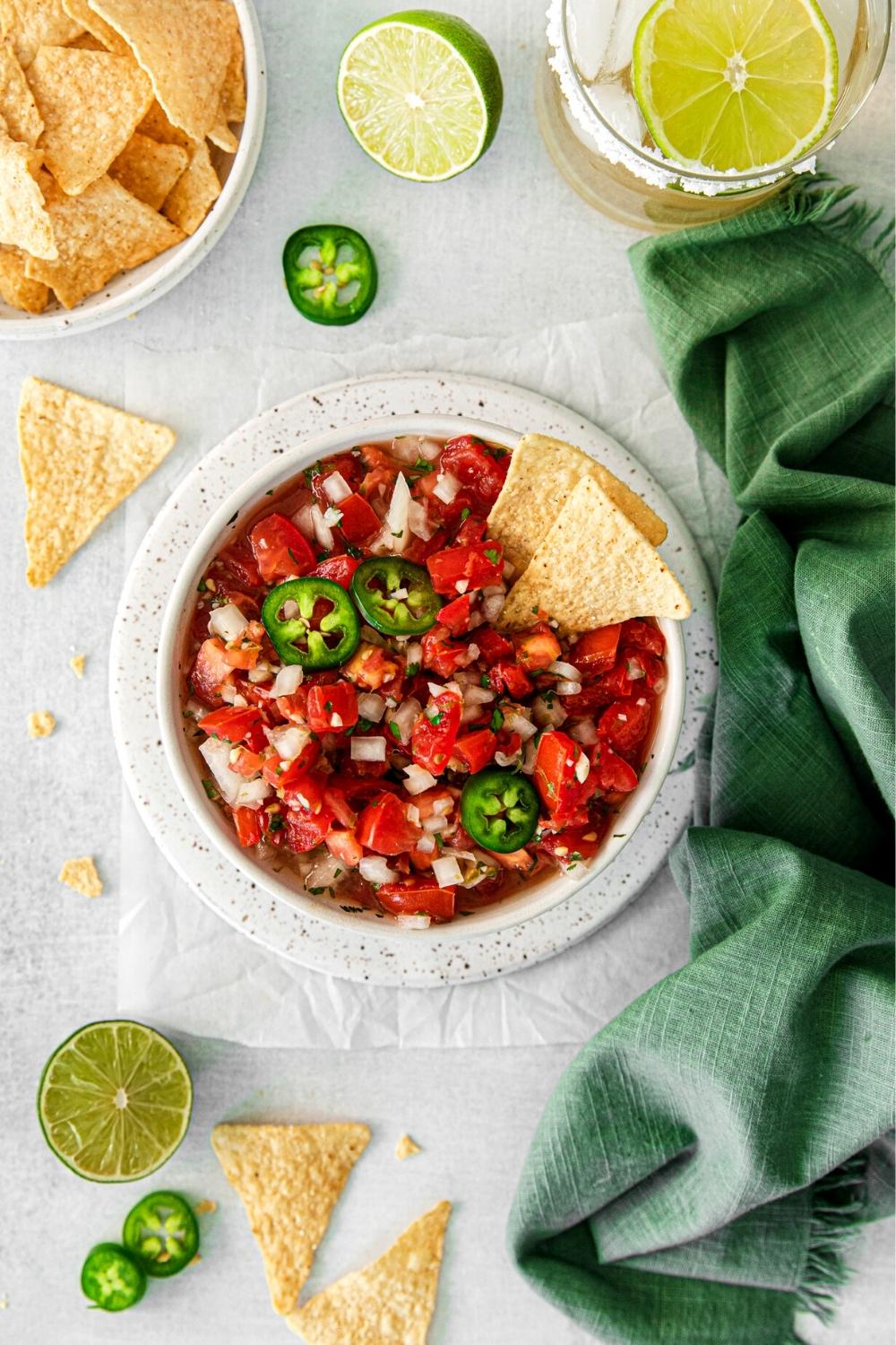 Authentic pico de gallo served in a bowl with restaurant-style tortilla chips.