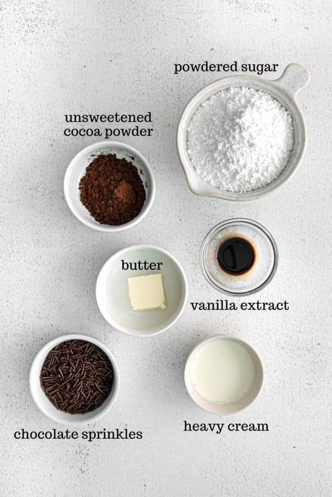 Ingredients for chocolate glaze with chocolate sprinkles for garnishing.