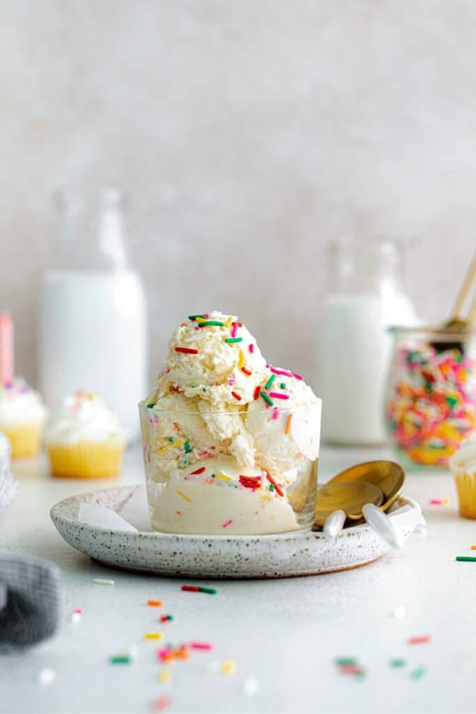 Vanilla funfetti ice cream with candy sprinkles for festive birthday celebrations.