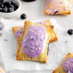 A batch of freshly frosted blueberry pop tarts, ready to eat.
