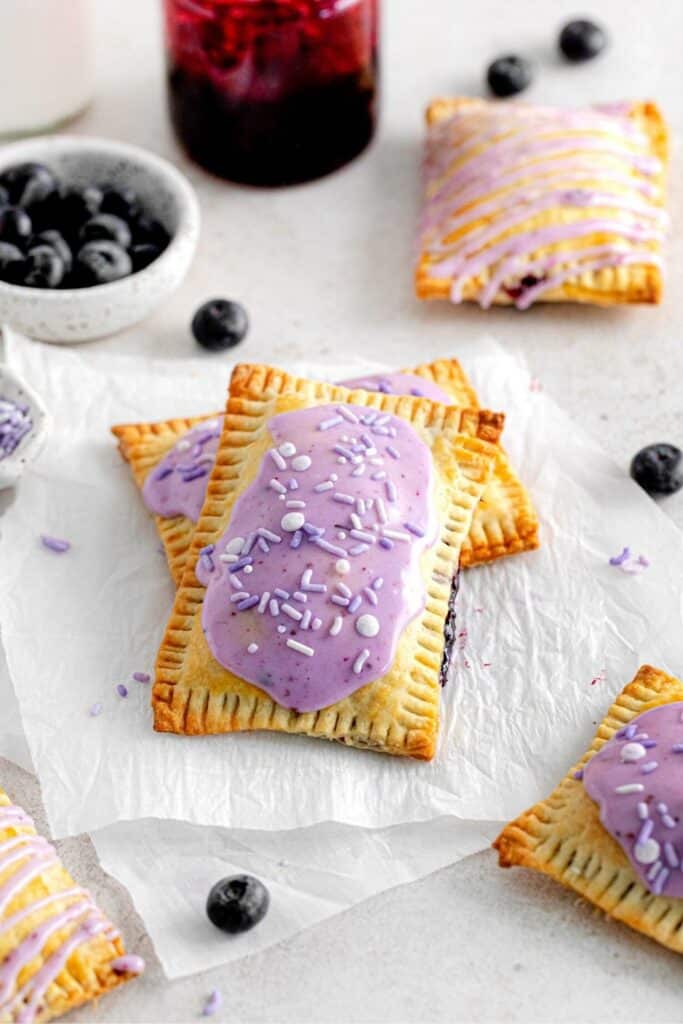 A batch of freshly frosted blueberry pop tarts, ready to eat.