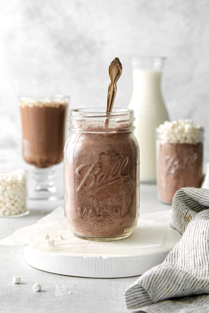 DIY hot cocoa mix in a mason jar with spoon.