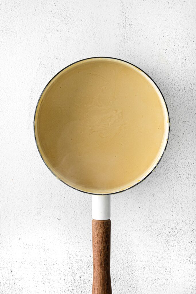 Homemade butterscotch pudding in a medium saucepan.