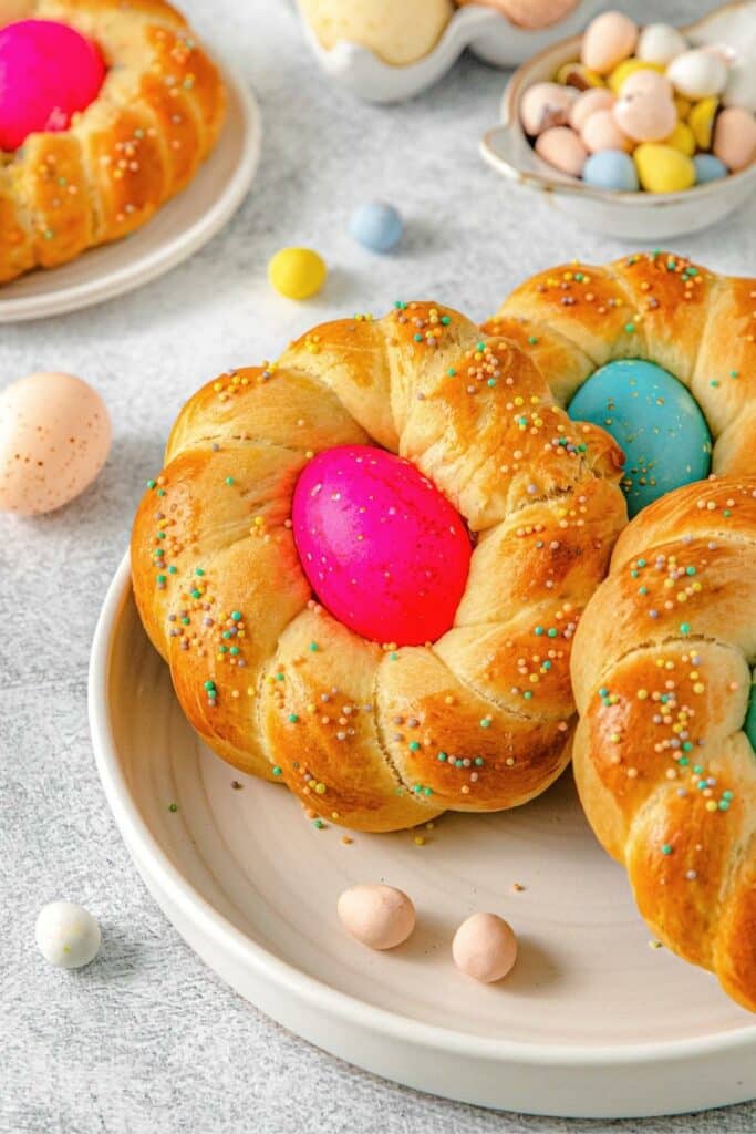 Three Italian Easter bread wreaths on a platter.
