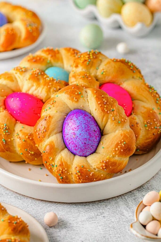 Several pieces of Easter Egg bread arranged on a serving platter.