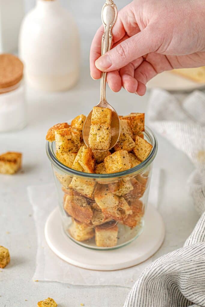 A spoonful of freshly-made mini sourdough croutons.