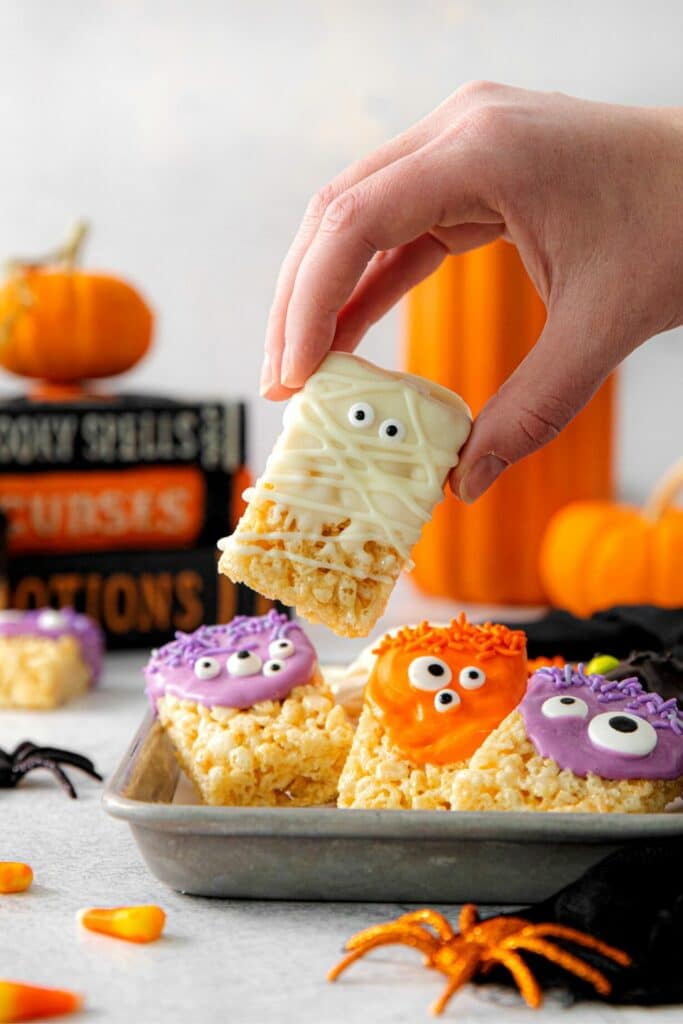 Monster and Mummy Rice Krispie Treats on a Halloween Dessert table.