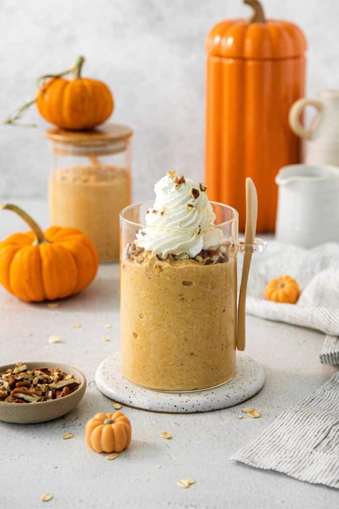 Pumpkin Spice Oatmeal in a glass jar with spoon.