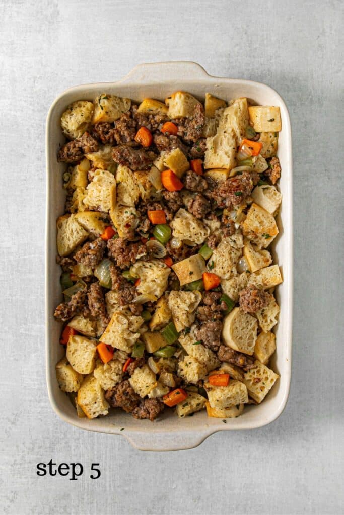 Italian sausage stuffing in a baking dish ready to go into the oven.